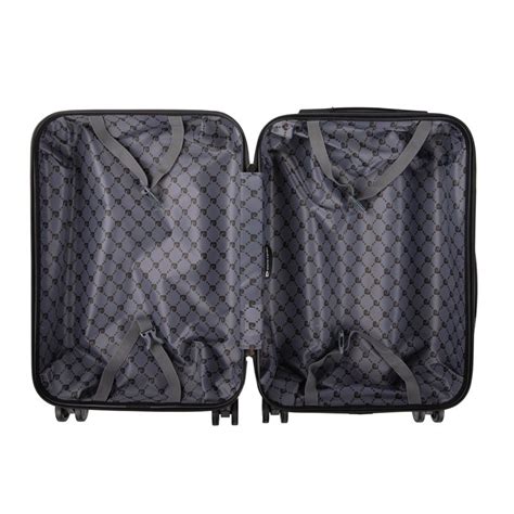 Intérieur détaillé d'une valise Pierre Cardin, mettant en évidence la sangle croisée, le compartiment à linge et le compartiment zippé.