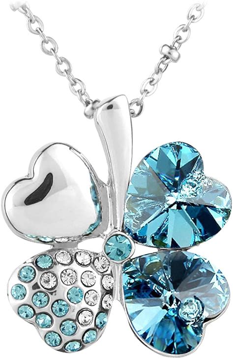 Pendentif trèfle Swarovski avec pierres en forme de cœur et pierre centrale scintillante