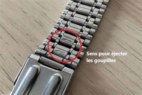 Photographie d'une montre Timex Q avec un bracelet en acier brossé, mettant en valeur son style vintage