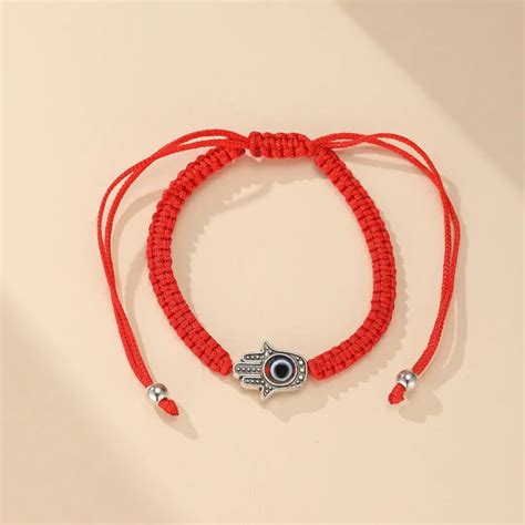 Bracelet Main de Fatma en corde rouge avec œil protecteur