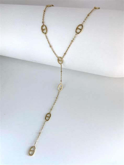 Collier long doré graphique de Zag Bijoux avec pendentif créole