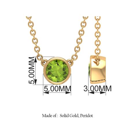Photographie d'un pendentif en or jaune avec un péridot de forme virgule, mettant en avant son design original.
