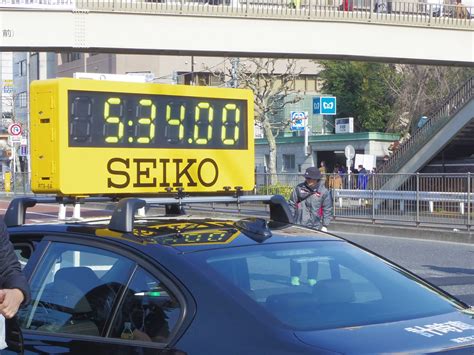 Publicité Seiko pour un système d'affichage mobile du temps lors du marathon de Tokyo