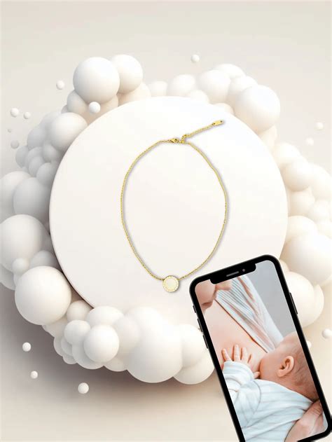 Illustration d'un bijou délicat en forme de perle, symbolisant le lait maternel.