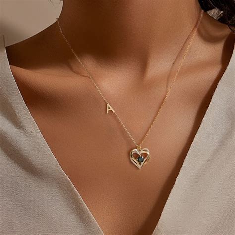 Exemple de pendentif cœur séparable avec des initiales gravées