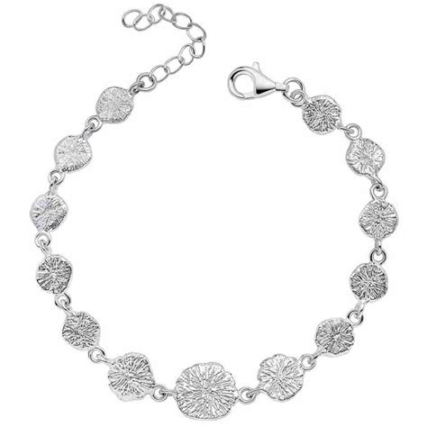Comparaison visuelle avant/après du nettoyage d'un bracelet en argent 925 terni.
