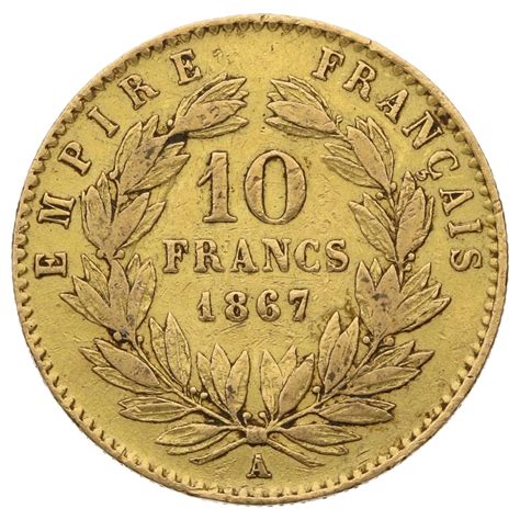 Gros plan sur une pièce de 10 francs Napoléon, montrant les détails de l'effigie et des inscriptions