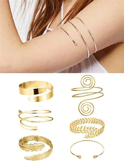 Collection de bracelets de bras aux styles variés : minimaliste, ethnique, serpent, et manchette.