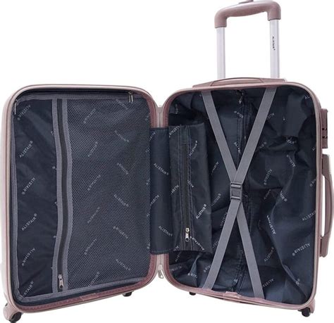 Intérieur d'une valise Alistair Airo 2.0 avec sangles de maintien et compartiments zippés