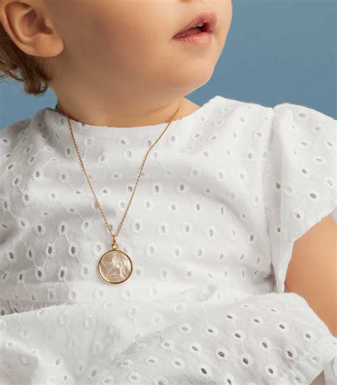 Ensemble médaille de baptême en or et chaîne assortie