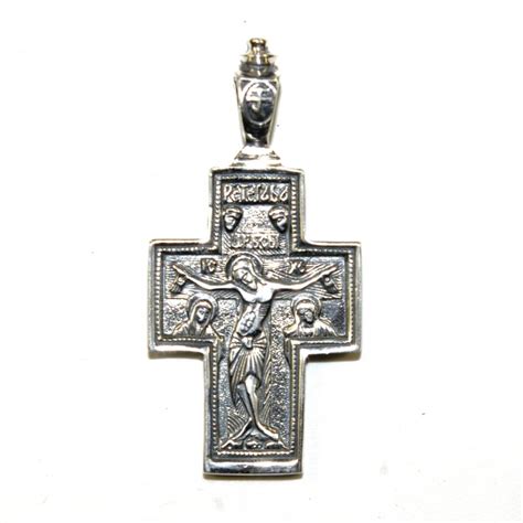 Croix religieuse en argent avec détails travaillés