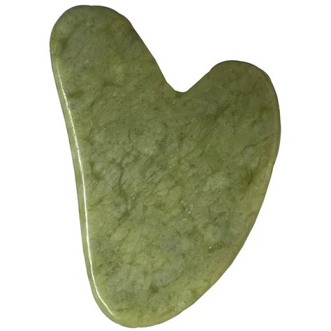 Comparaison visuelle entre un Gua Sha en jade véritable et une imitation.