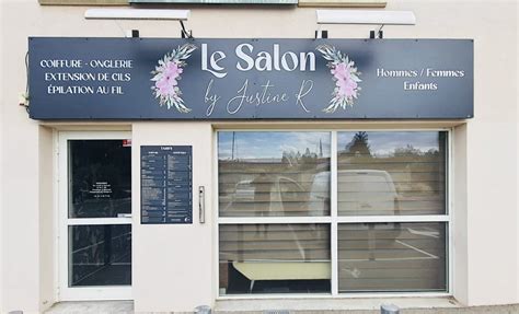Photo d'une enseigne de salon de coiffure avec un jeu de mots.