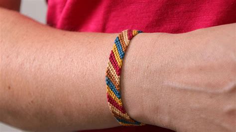 Schéma illustrant le calcul de la longueur de fil pour un bracelet brésilien