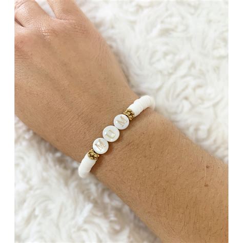 Bracelet Bouton artisanal avec perles en nacre jaune et blanche