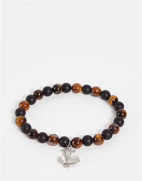 Bracelet avec breloque ancre et perles bleues