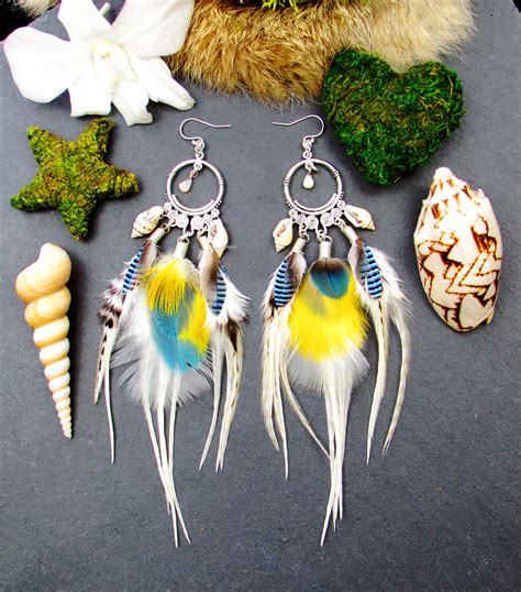 Diversité de boucles d'oreilles plume en argent blanc et plumes naturelles